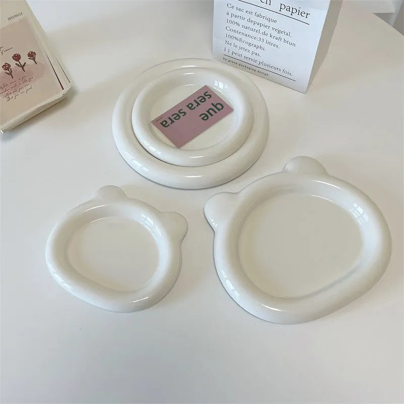 White porcelain plate with bear doodle design in round shape showing 15cm and 20cm size options