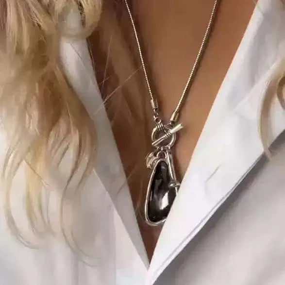 Geometric alloy pendant necklace with snake bones chain in blue, champagne, and grey colour options
