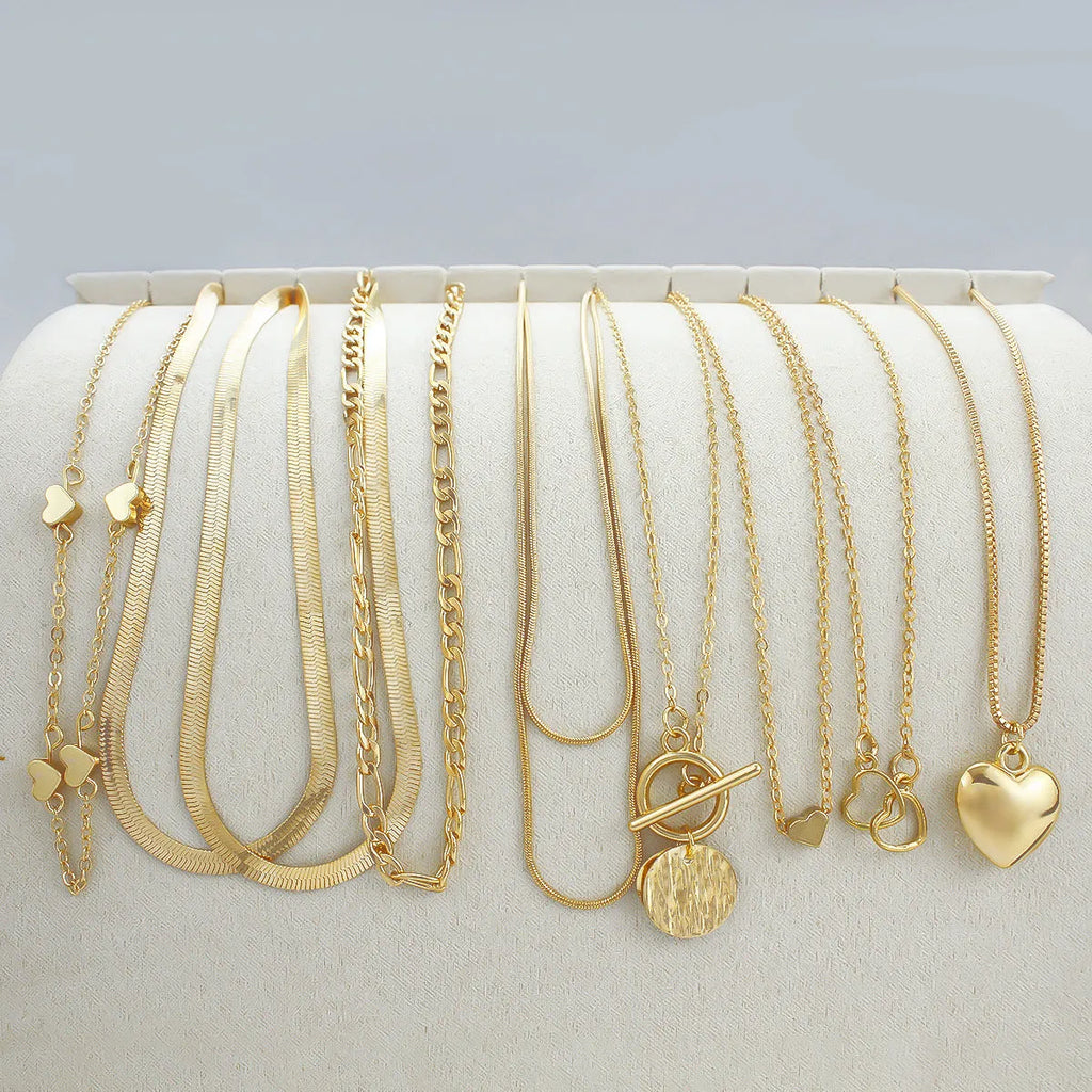 10-piece women's gold electroplated necklace set with adjustable length and snake bone chain design