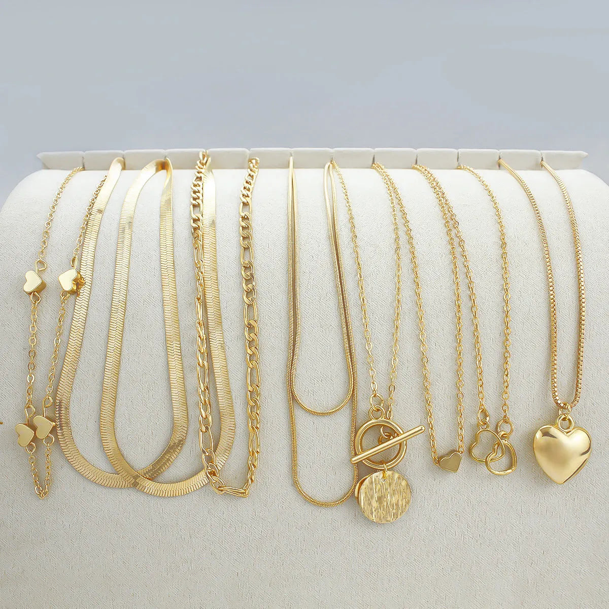 10-piece women's gold electroplated necklace set with adjustable length and snake bone chain design