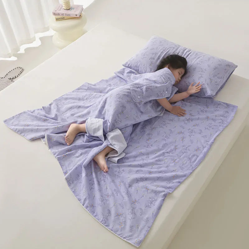 Light blue anti-kick summer blanket with antibacterial filler on a bed