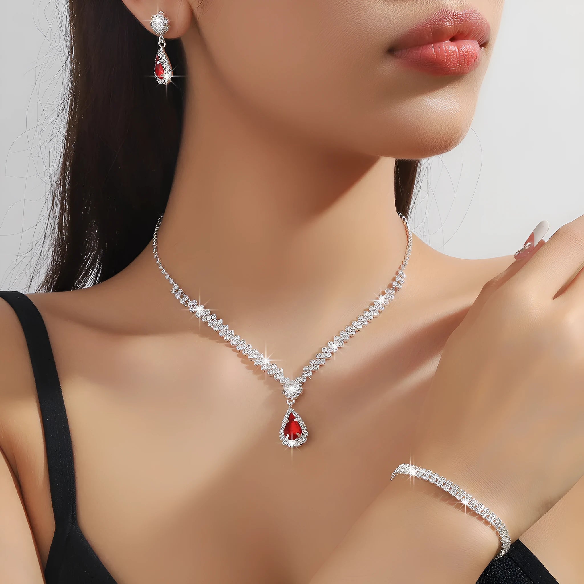 Claw chain rhinestone jewellery set with water drop shaped necklace and matching earrings in blue, green, pink, red, or white