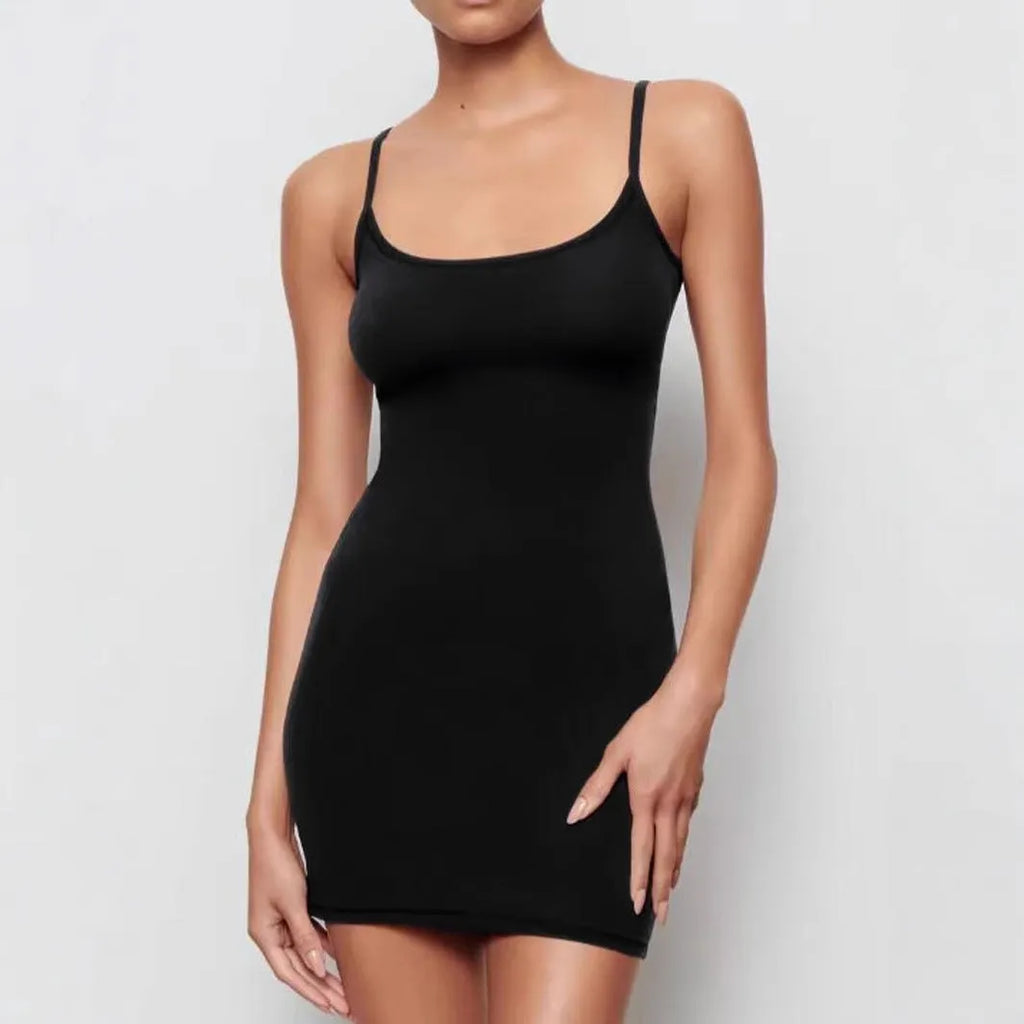 Black sling style sheath dress with skinny silhouette and short skirt length