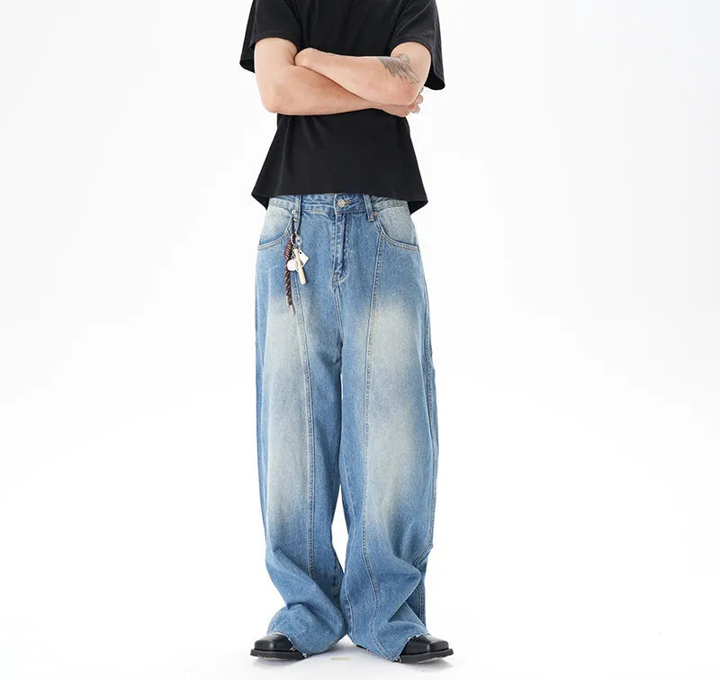 Cut washed vintage washed wide leg machete jeans in light blue denim with zipper fly, front view
