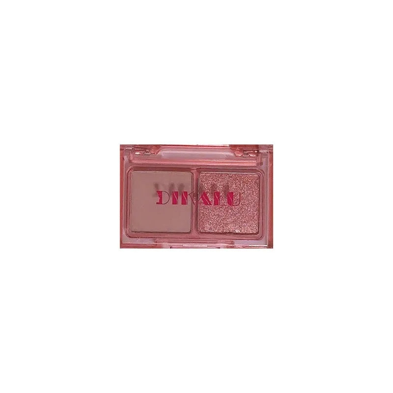 Cool two-tone eye shadow compact showing pink and black matte and shimmer shades for punk style makeup