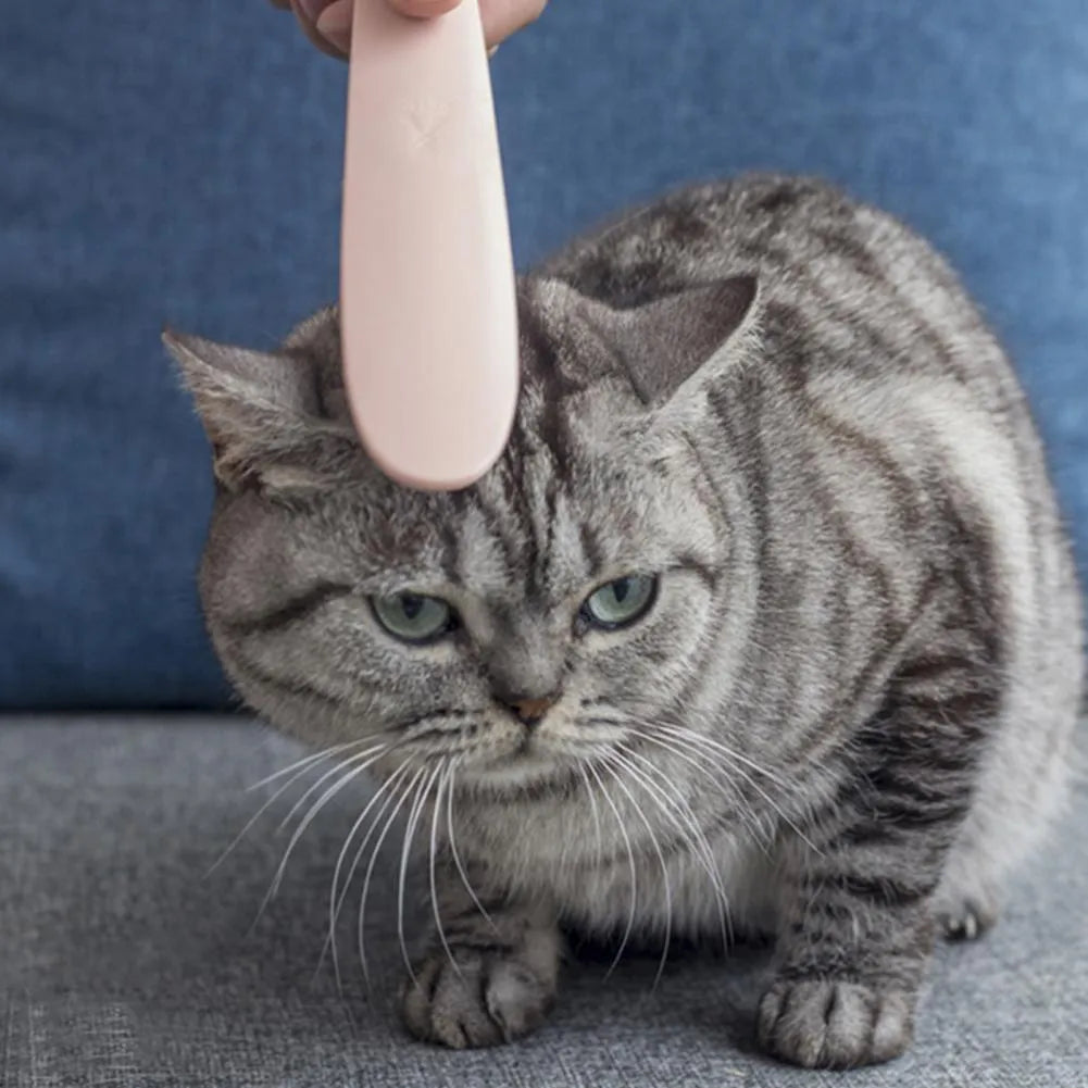 Gray ABS cat comb with tongue massage surface and ergonomic handle