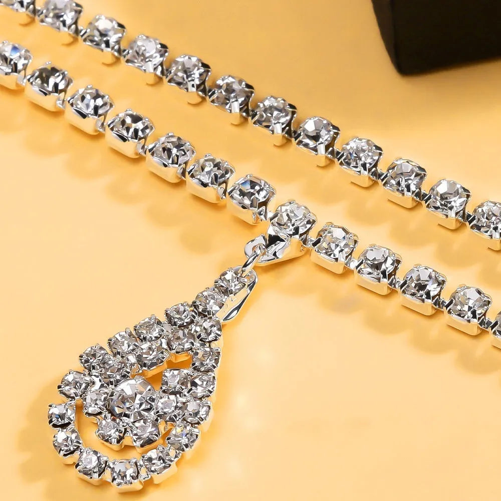 Gold rhinestone waist chain with tassel pendant and lobster buckle, 115cm length