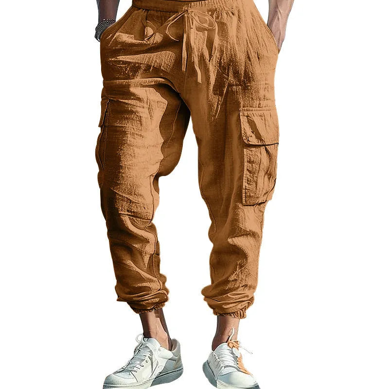 Men's ankle-tied loose fit linen casual trousers in army green, showing multiple pockets and drawstring waist.