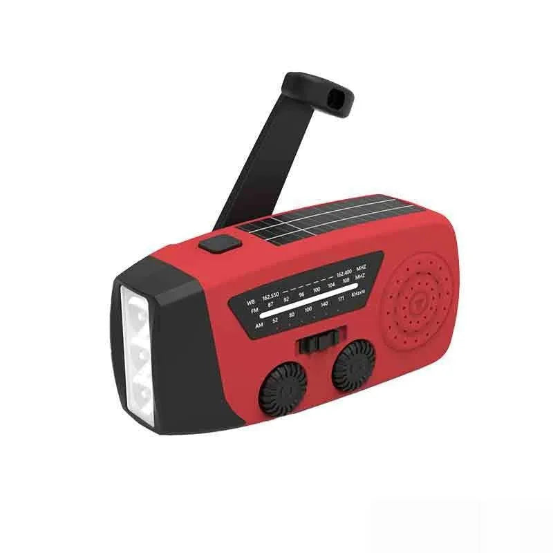 Red rechargeable hand radio emergency torch with ABS body, USB port, and wrist strap on plain background