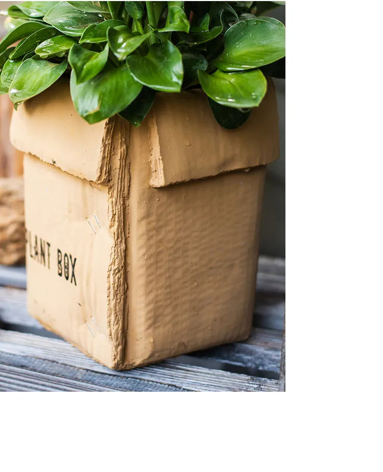 Cement flowerpot with drainage holes in a Nordic style, shown in a cement imitation carton finish.