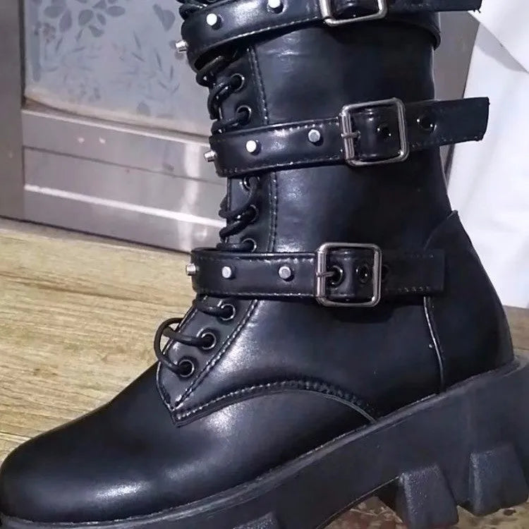 Women's black mid-calf boots with metal buckle strap and side zip on a white background.