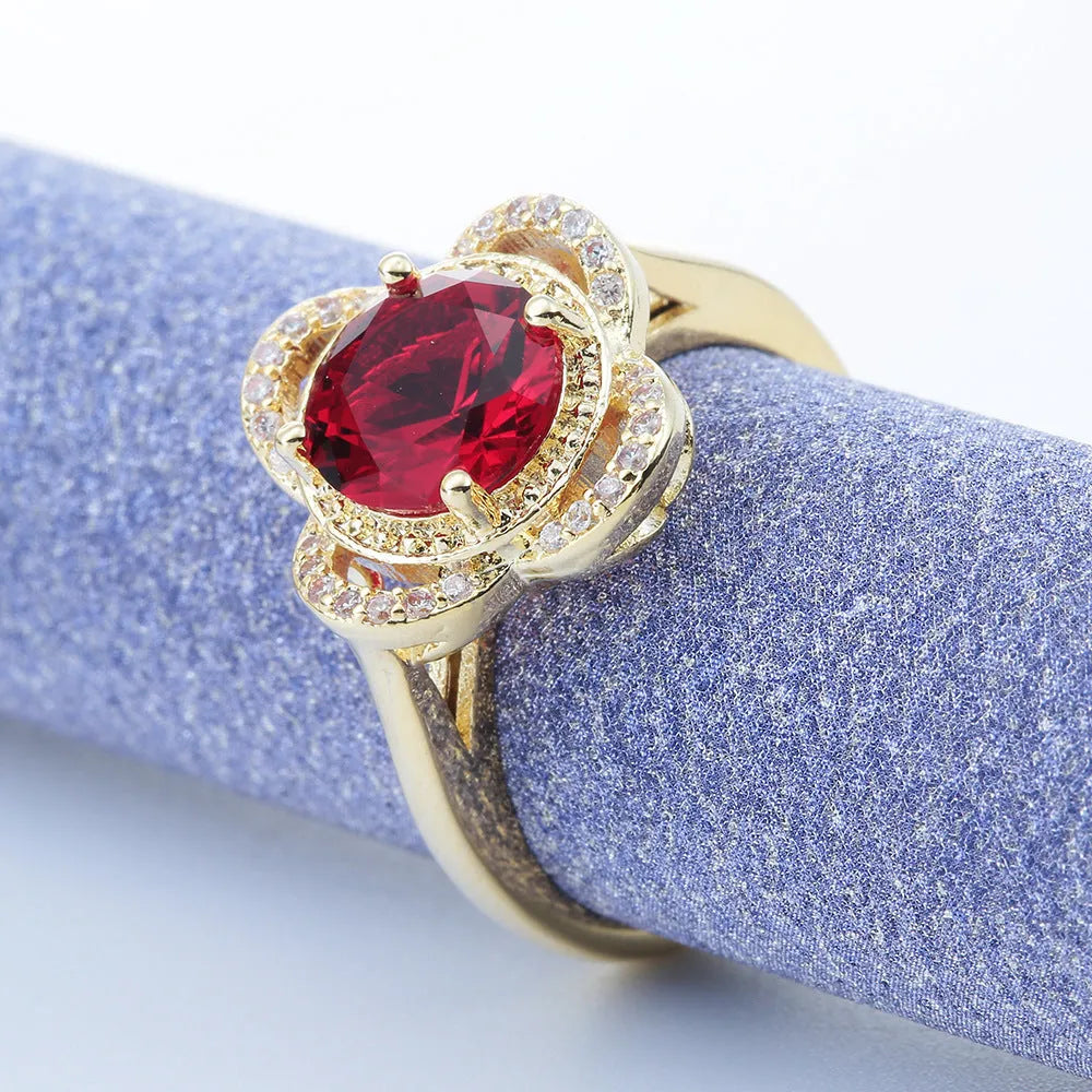 Copper fruit-shaped zircon ring for men and women on a plain background.