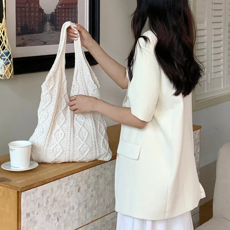 Retro hollow-knitted women's shoulder tote bag in a solid colour with double straps.