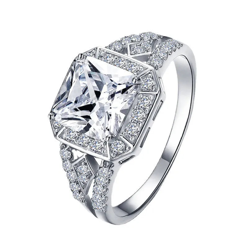 Geometric zircon ring with hollow quadrilateral design in platinum colour on copper band