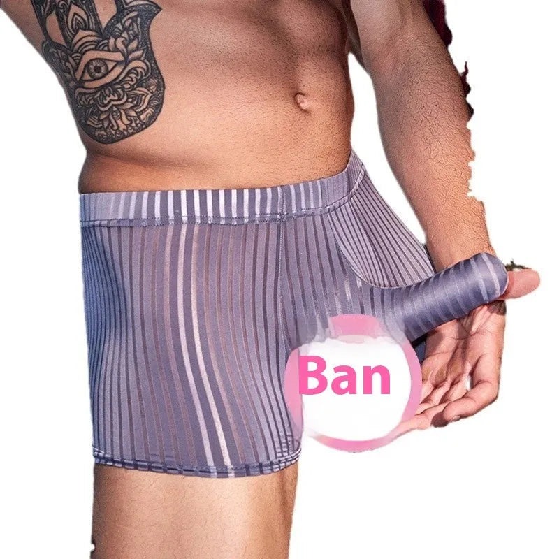 Man wearing black striped nylon boxer briefs, showing high elastic fit and modern design.