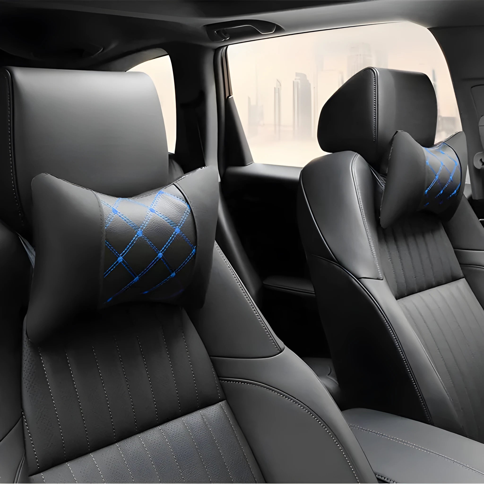 Quilted diamond pattern car neck pillow in black artificial leather with blue piping.