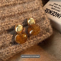 Three pairs of handmade geometric holiday earrings with tassel elements in alloy with electroplating treatment