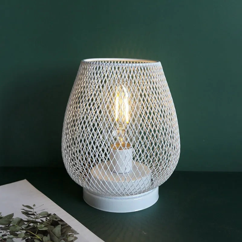Retro iron art battery-powered table lamp with hollowed-out birdcage design in white finish