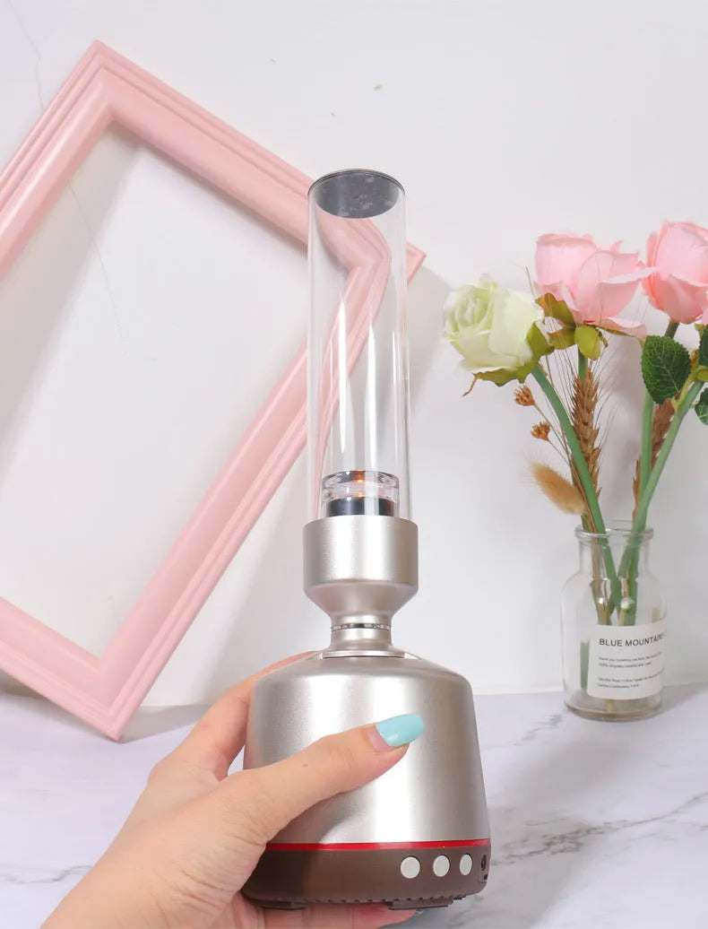 White silver cylindrical Bluetooth speaker with candlelight night light measuring 277mm tall