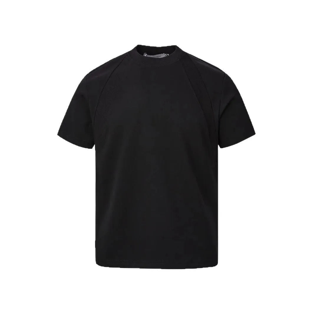 Men's black loose-fit short sleeve top with textured air layer stitching detail.