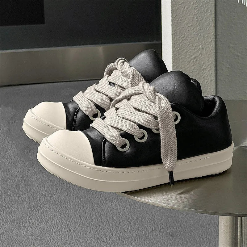 Men's black leather low-top slip-on casual shoes with raised bottom board, round toe, and front lace-up