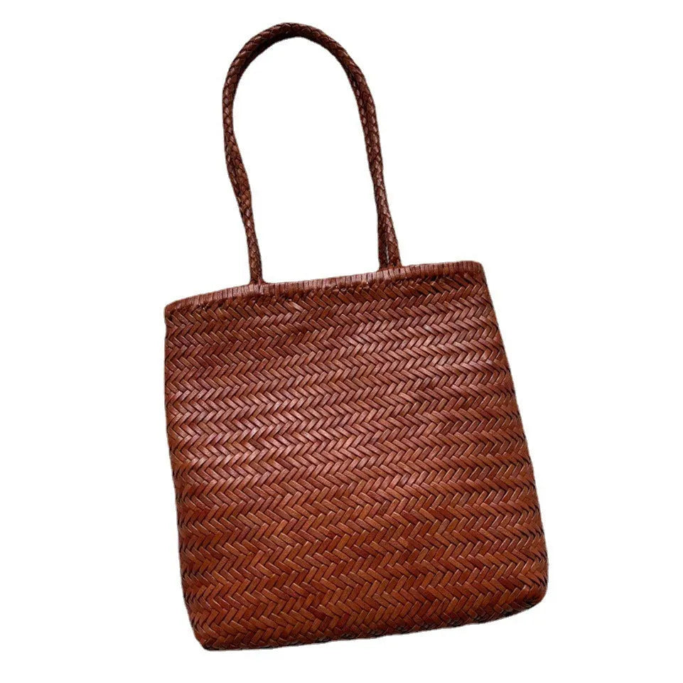 Handmade vintage woven leather shoulder bag in brown with three-dimensional pockets