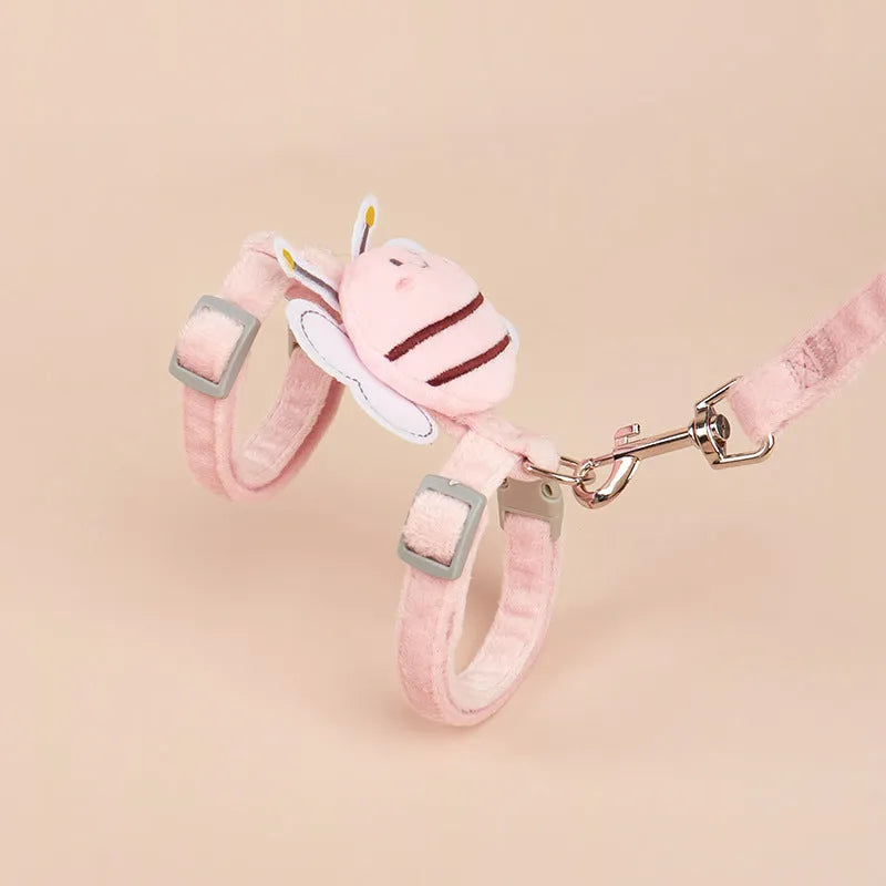 Bee-shaped pink cat collar and lead set for walking, shown with hand-held rope.