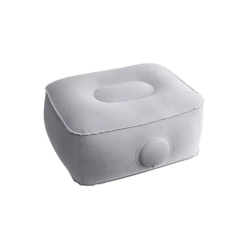 Portable press inflatable seat cushion with flocking surface folded and deflated on a table