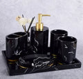 Ceramic bathroom set with emulsion bottle, cup, toothbrush holder, and soap dish in Phnom Penh Ink and Black bright glaze finish