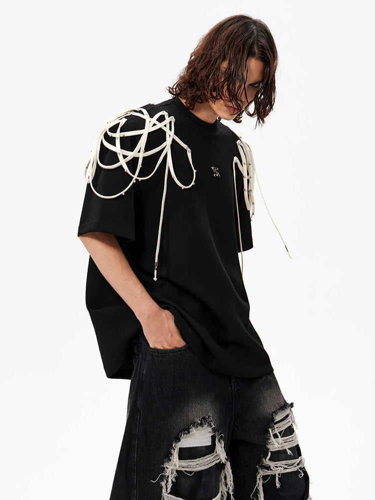 Black loose fit short-sleeve T-shirt with padded shoulders and decorative rivet ribbons.