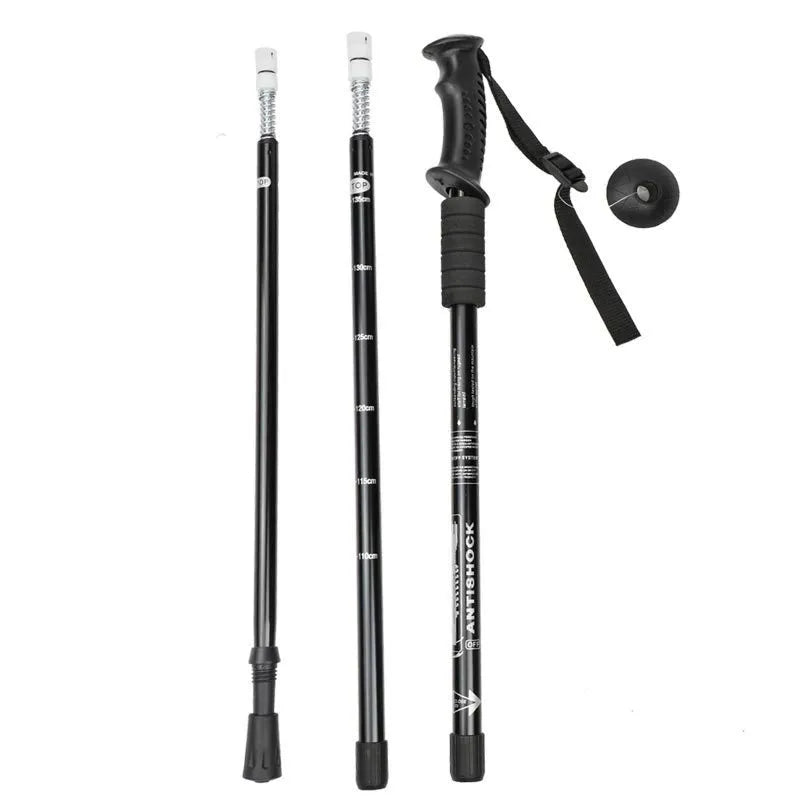 Aluminium alloy trekking poles adjustable 65-135cm with mud supports and snow holders on a mountain trail
