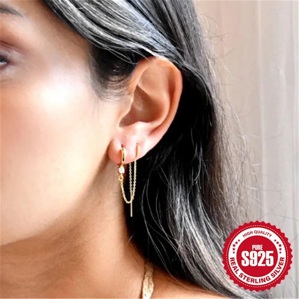 S925 sterling silver ear clip stud earrings with flower, tassel, and chain design in a gold colour.