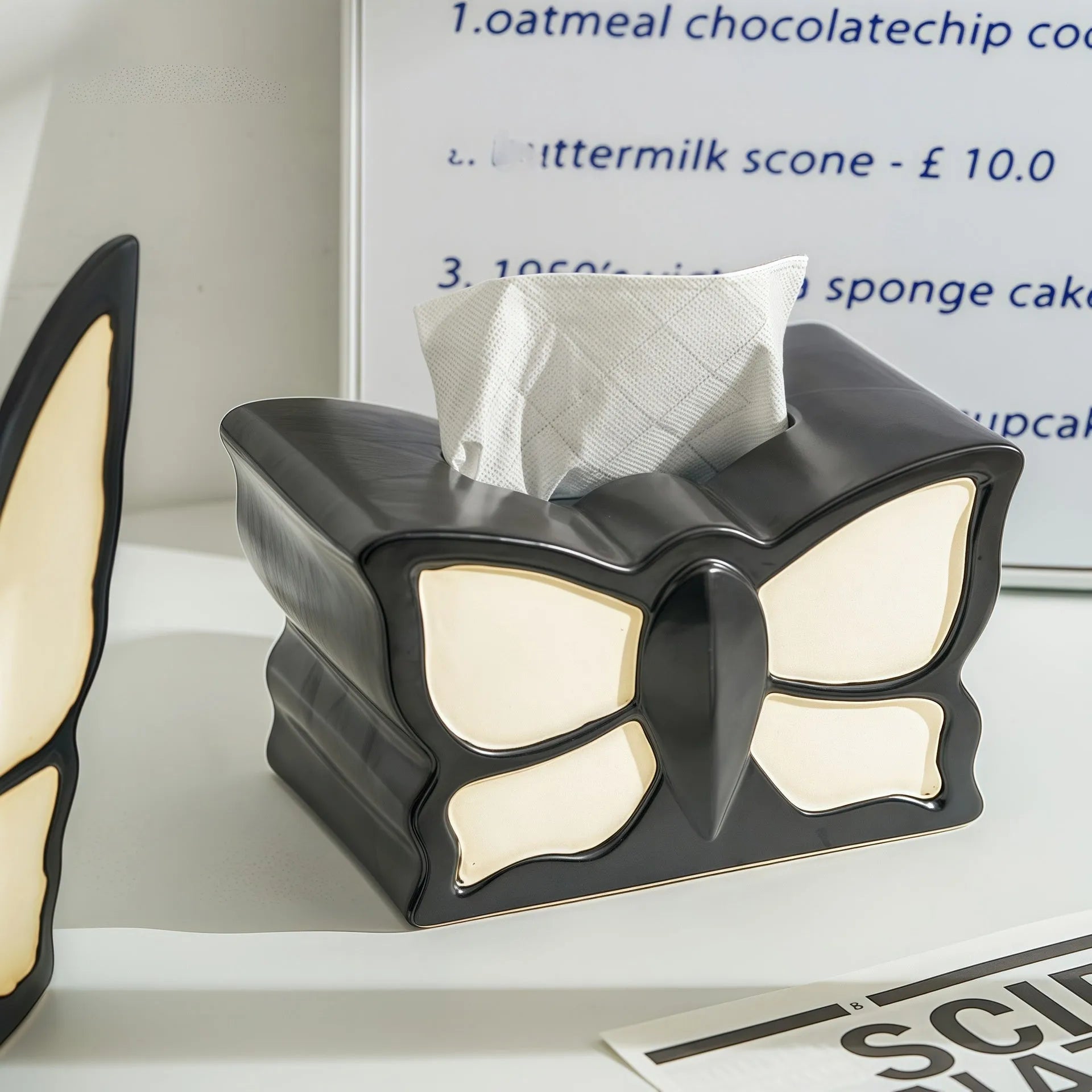 Ceramic light luxury butterfly tissue box and vase set on a living room side table