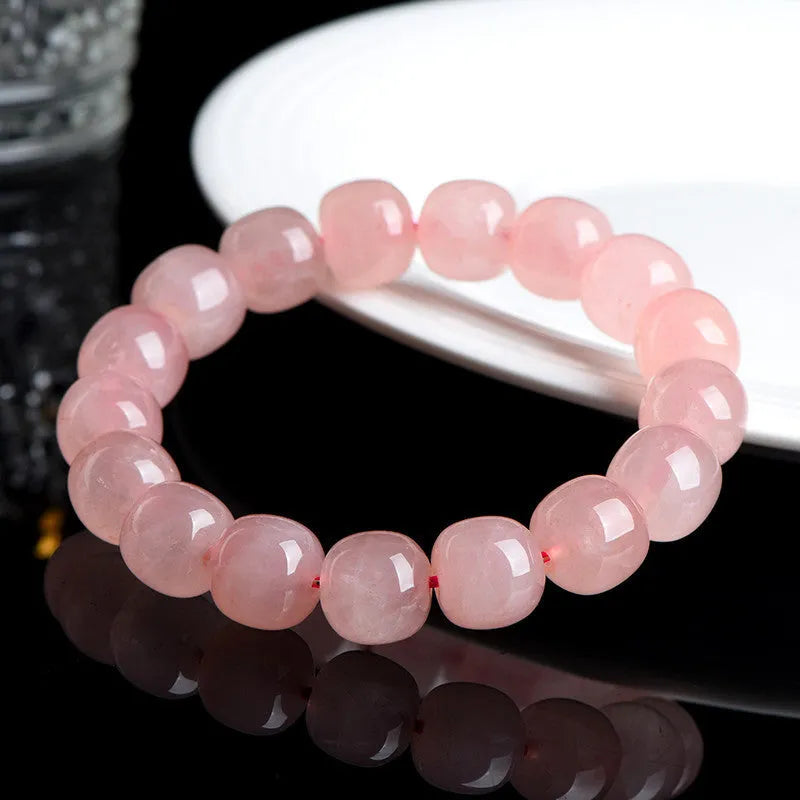Pink natural crystal barrel bead bracelet with polished 8 x 10mm beads