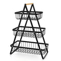 Detachable double-layer iron fruit basket with wooden handle in black on a tabletop