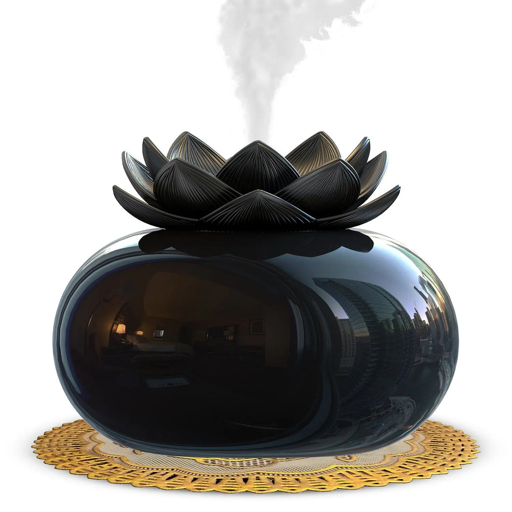 Pure black USB lotus-shaped ultrasonic humidifier and aromatherapy diffuser on a desk.