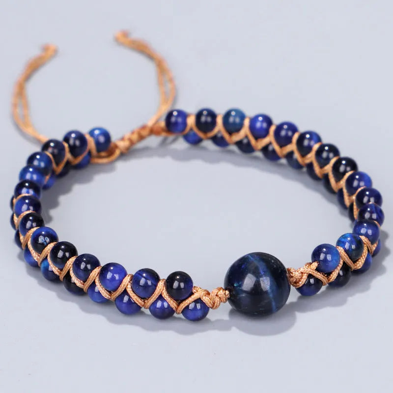 Hand-woven Tigereye gemstone pull bracelet showing geometric pattern and natural stone texture