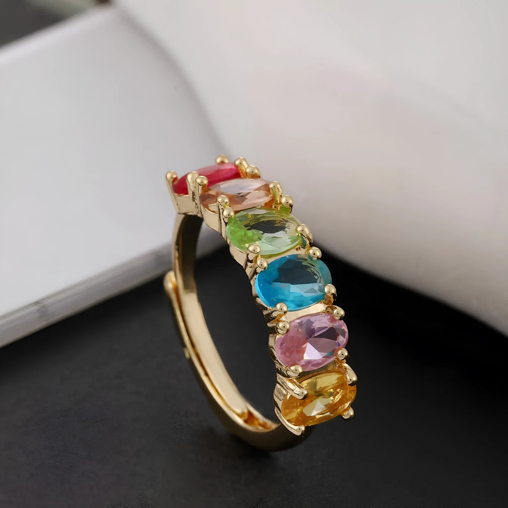 Gold-colour adjustable zircon ring with a simple retro design on a white background.