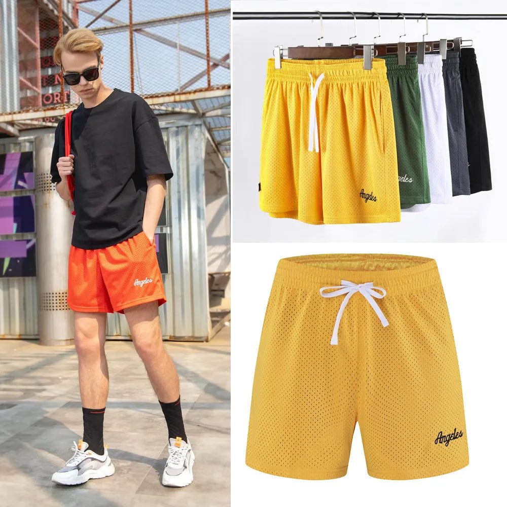 Men's black double-layer mesh sports shorts laid flat, showing waistband and loose fit.