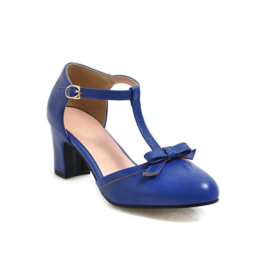 Women's apricot coloured chunky heel sandals with a buckle strap and bow tie detail on a 6.5cm heel.
