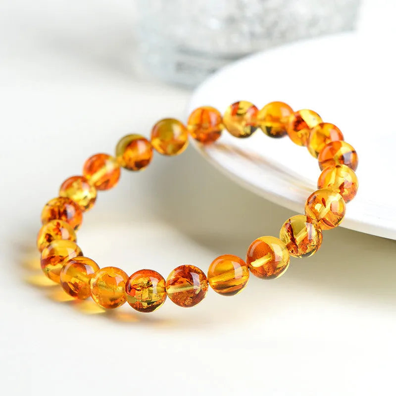 Natural yellow piebald amber bracelet with geometric beads for water purification therapy