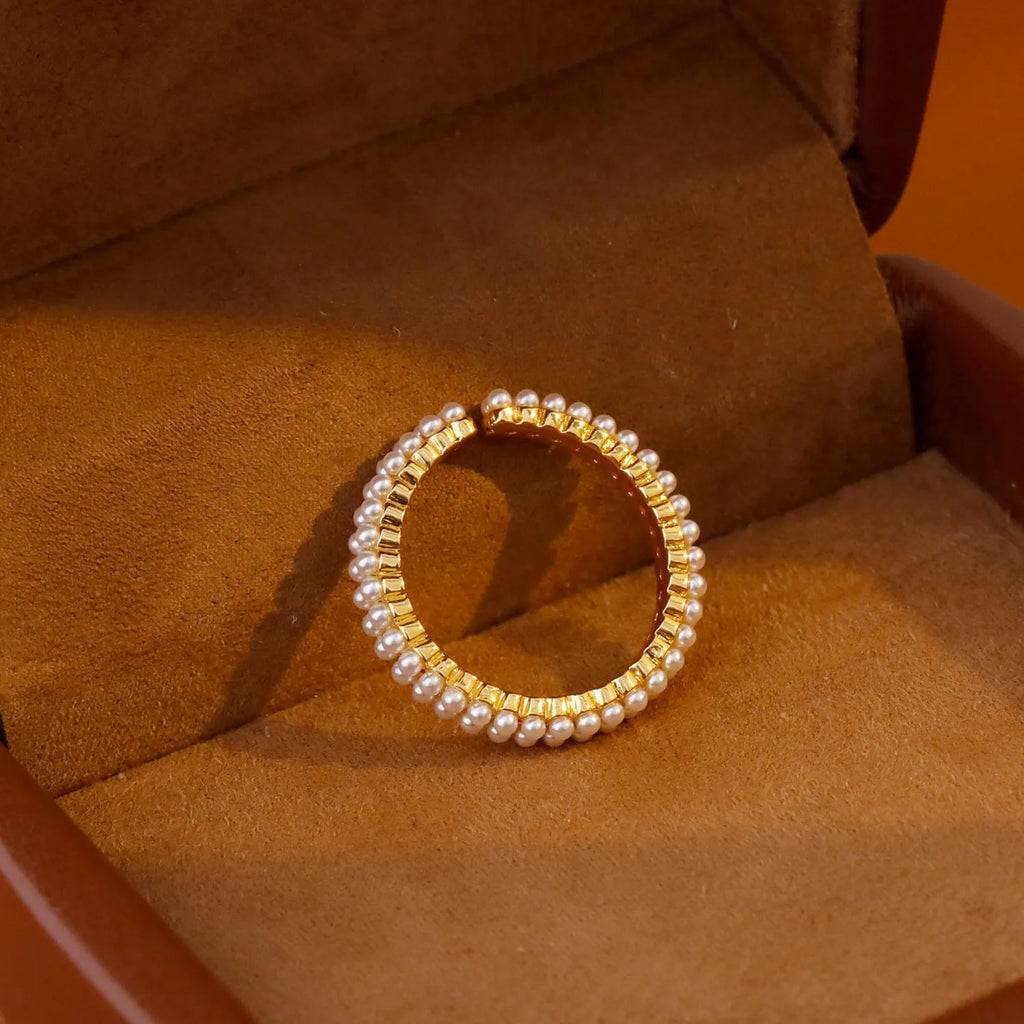 Gold geometric open mouth women's ring with pearl elements on electroplated copper