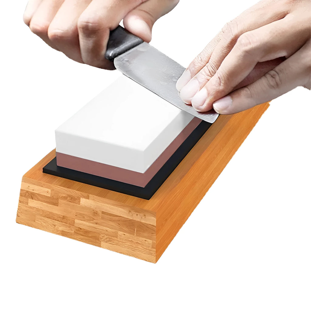 Double-sided white corundum kitchen whetstone 3000/8000 grit with bamboo base and knife holder locator on white background