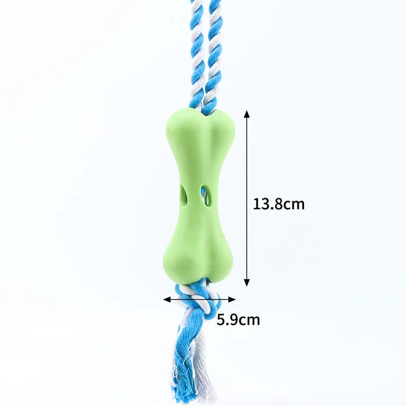 Red porous bone rope knot dog toy with treat-holding centre on white background