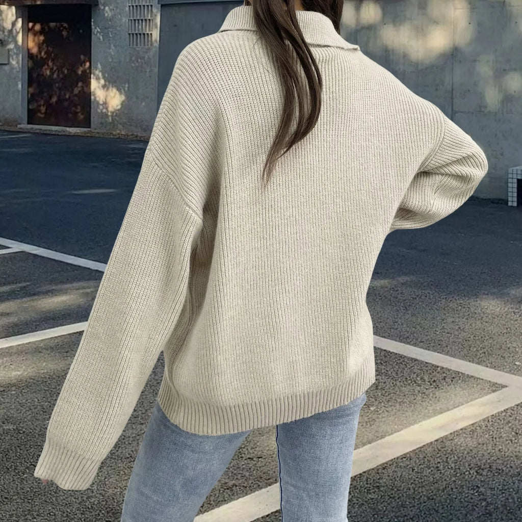 Light khaki women's alpaca wool pullover sweater with a diagonal front zipper and turtleneck.