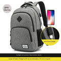 Gray USB charging backpack with luggage strap on a trolley case, showing charging port.