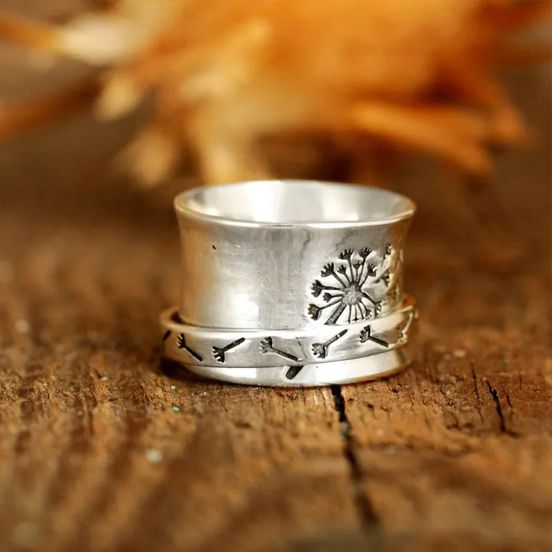 Silver electroplated alloy flower ring with rotatable design on finger
