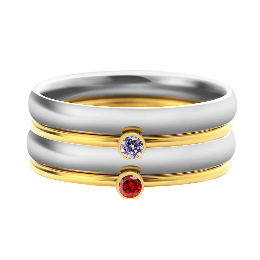 Gold-plated titanium steel ring with geometric engraved design and December birthstone colour accent