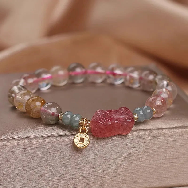 Single circle coloured hair crystal bracelet with zircon butterfly motif on light background