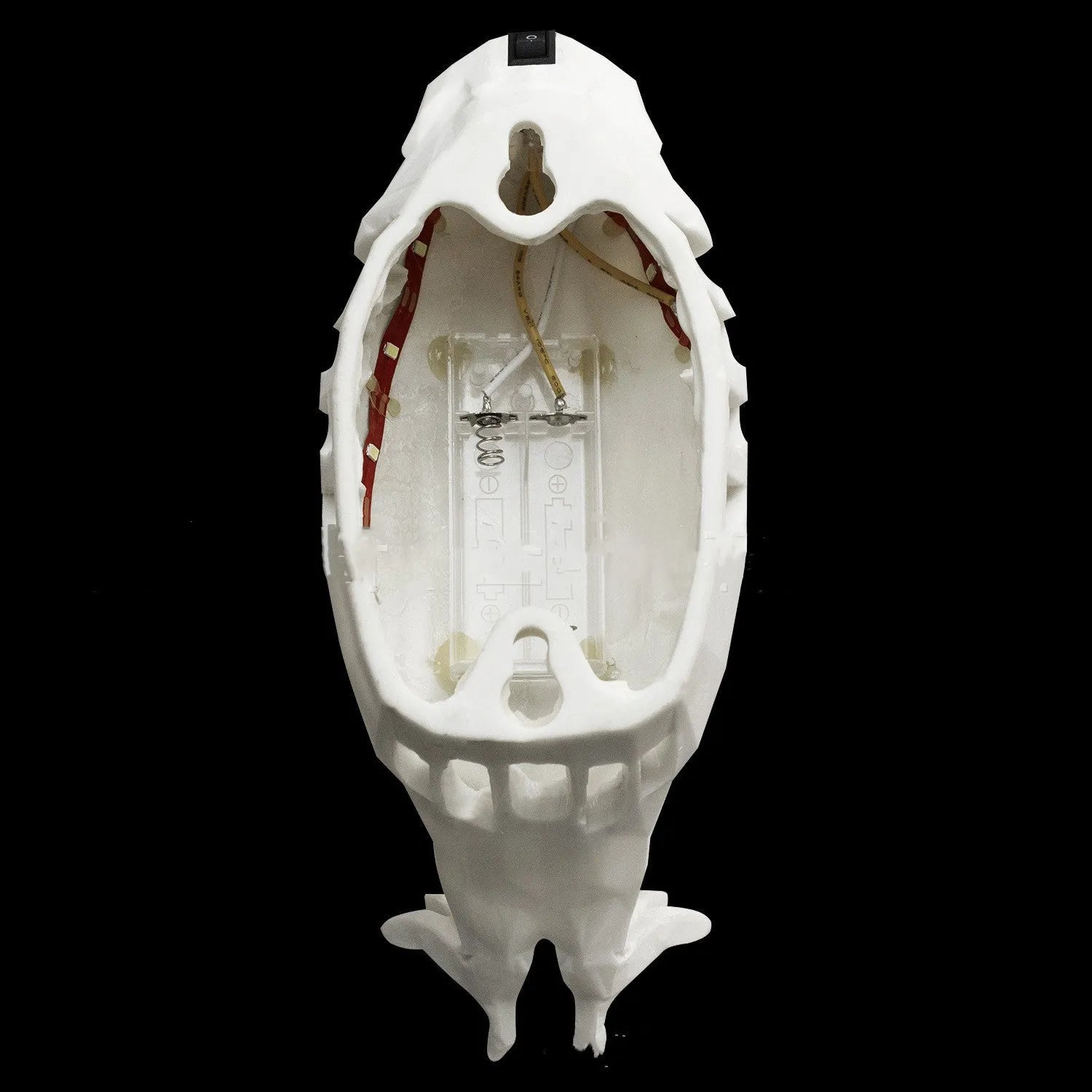 Eagle-shaped resin wall lamp with 3D print body projecting light and shadow on a wall